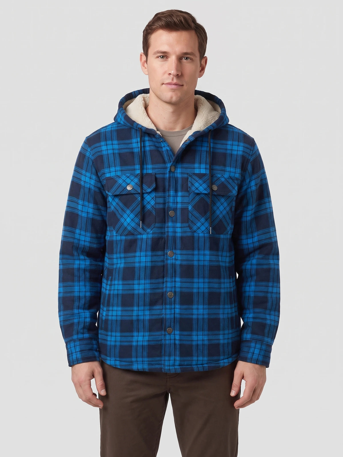 Front studio view of a model wearing a Blue plaid Sherpa Lined Jacket with a hood, button front, and flap chest pockets.