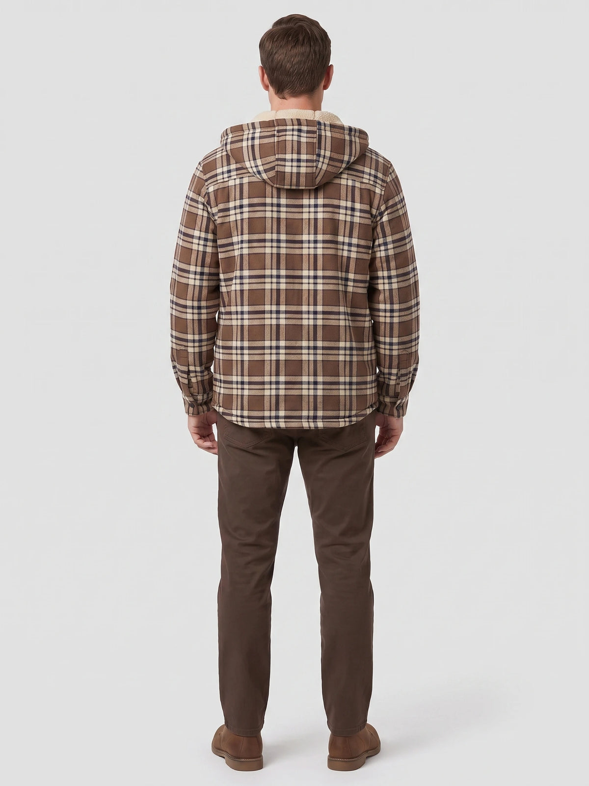Rear studio view of a model wearing a Brown Sherpa Lined Jacket with a plaid exterior and hood.