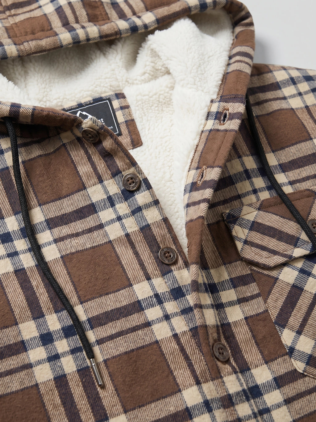 Close-up of the Brown Sherpa Lined Jacket showing its hood, soft lining, button-front placket, drawcord, and chest pocket.