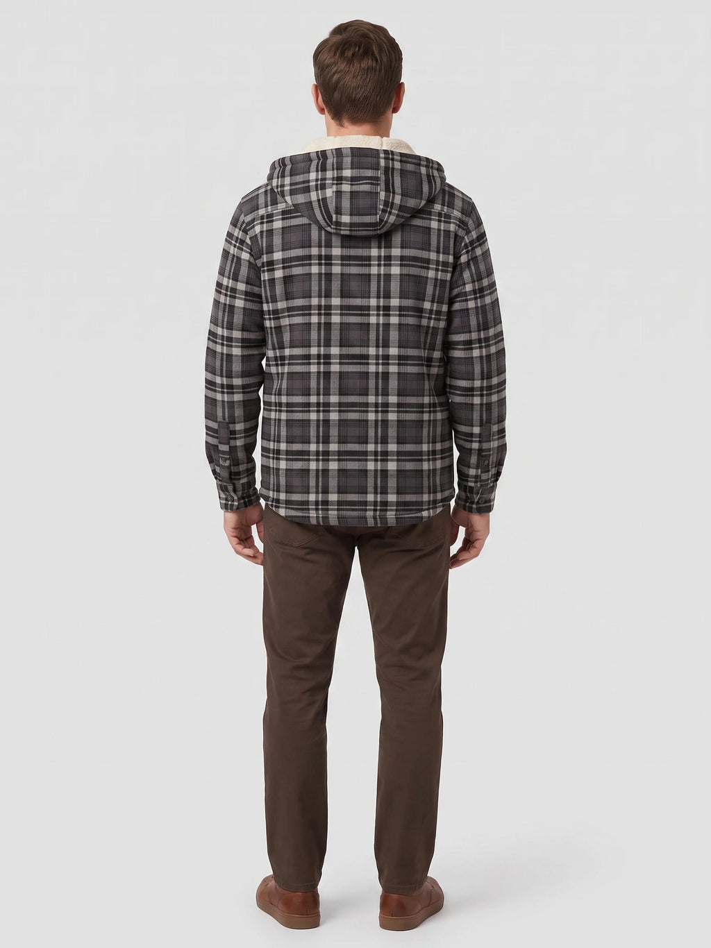 Rear studio view of a model wearing a Gray Sherpa Lined Jacket with a plaid exterior and hood.