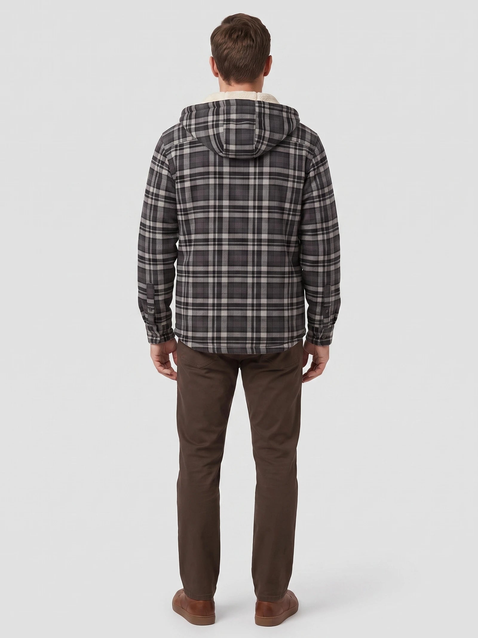Rear studio view of a model wearing a Gray Sherpa Lined Jacket with a plaid exterior and hood.