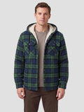 Front studio view of a model wearing a Green Sherpa Lined Jacket with a hood, plaid pattern, button front, and chest flap pockets.