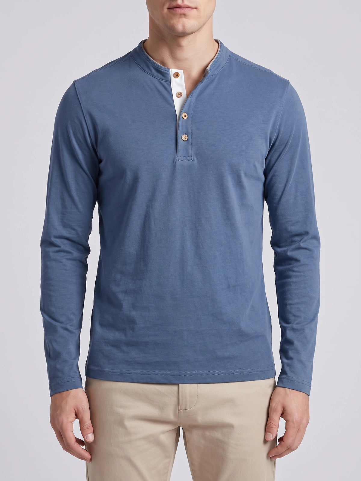 Front studio view of a model wearing a Blue Slim-Fit cotton long-sleeve Henley shirt with a button placket.