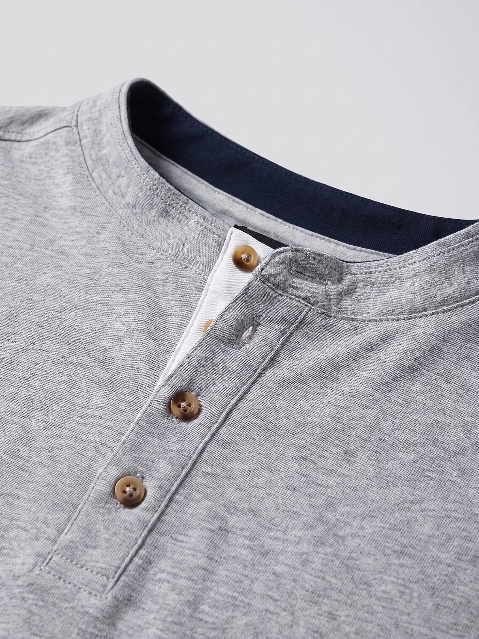 Close-up of the Gray Slim-Fit cotton Henley shirt’s stitched neckline and three-button placket.