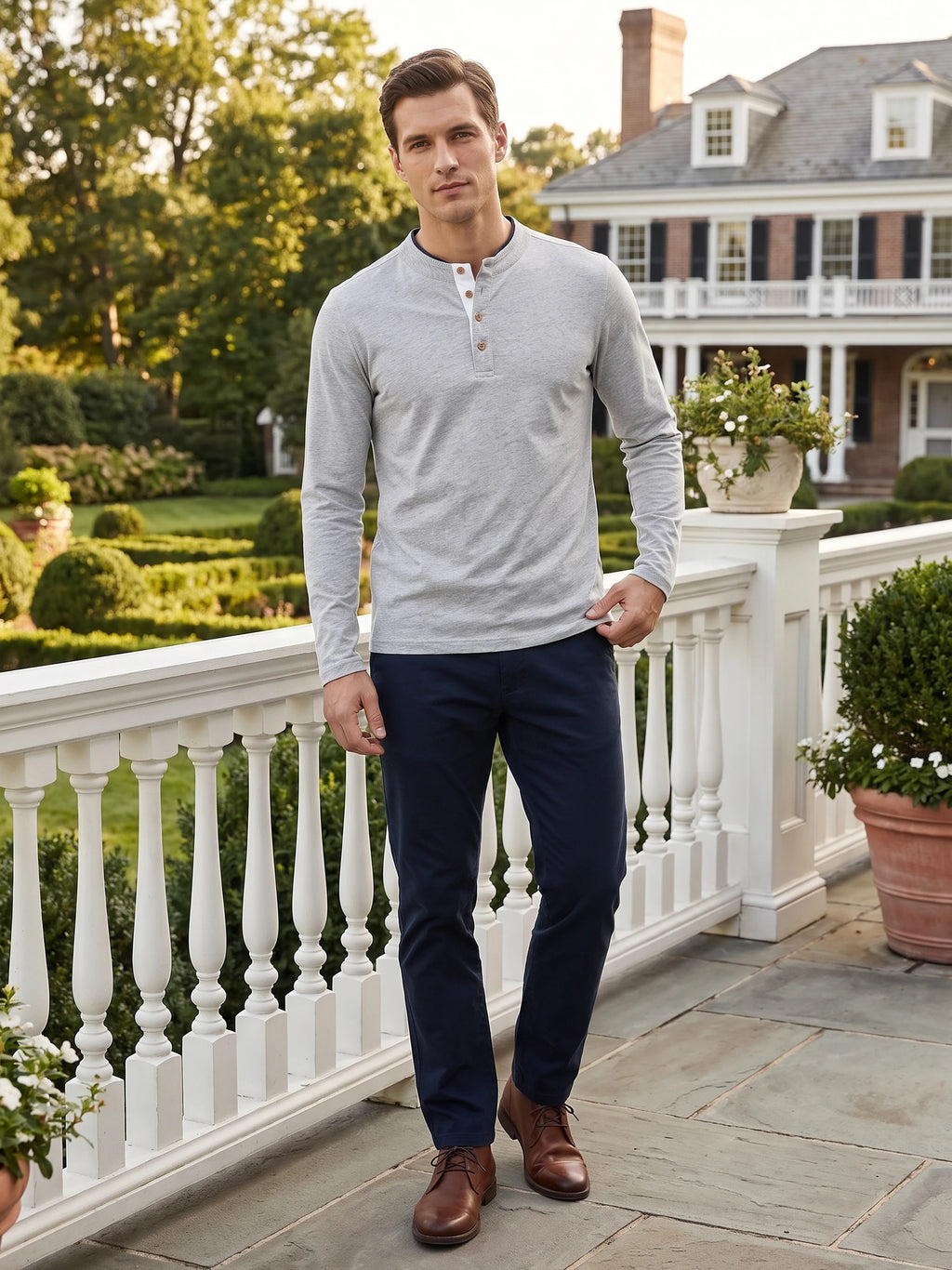 Model wearing a Gray Slim-Fit cotton long-sleeve Henley shirt on a garden terrace outside a home.