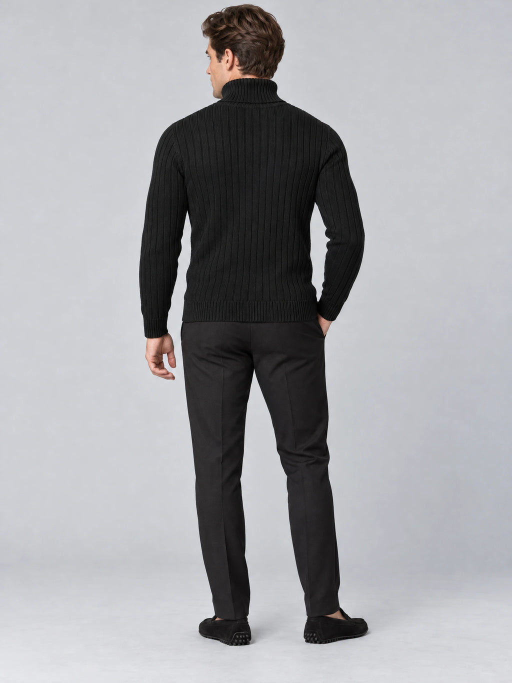 Rear studio view of a model wearing a Black slim fit pullover sweater with a ribbed turtleneck and vertical knit texture.