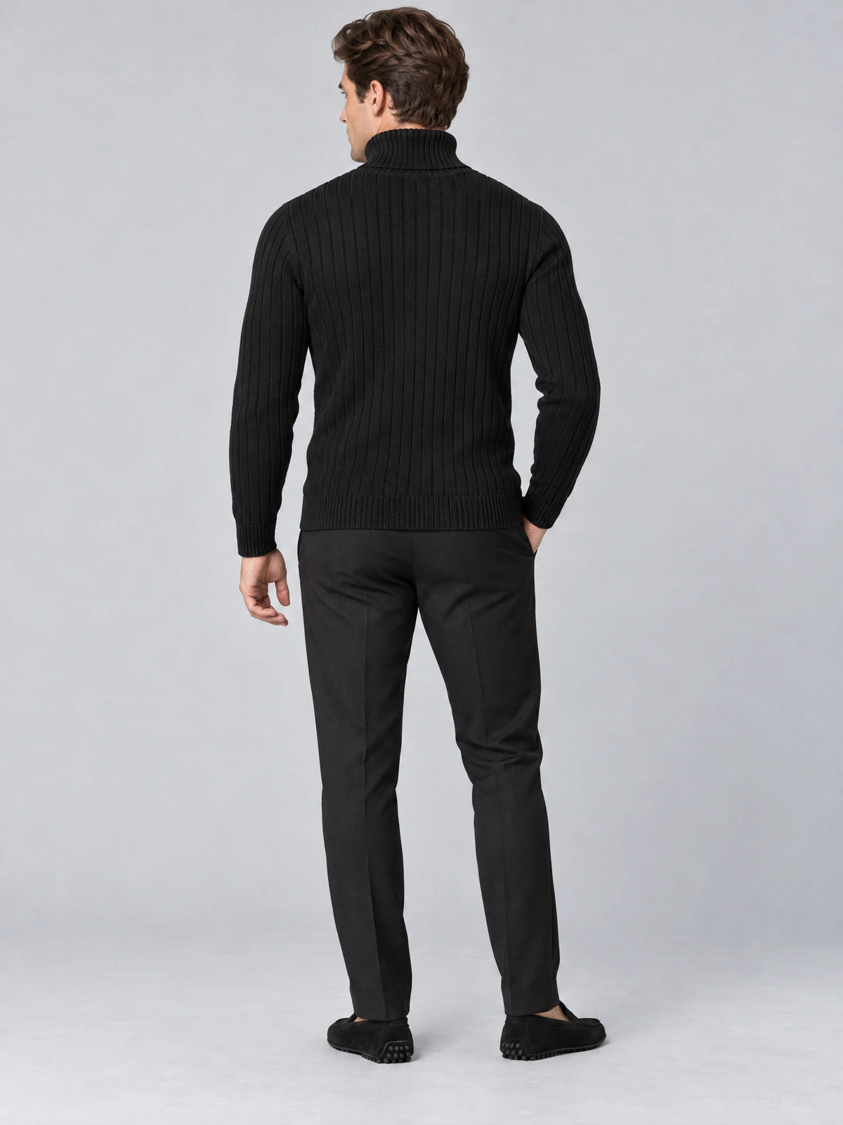 Rear studio view of a model wearing a Black slim fit pullover sweater with a ribbed turtleneck and vertical knit texture.