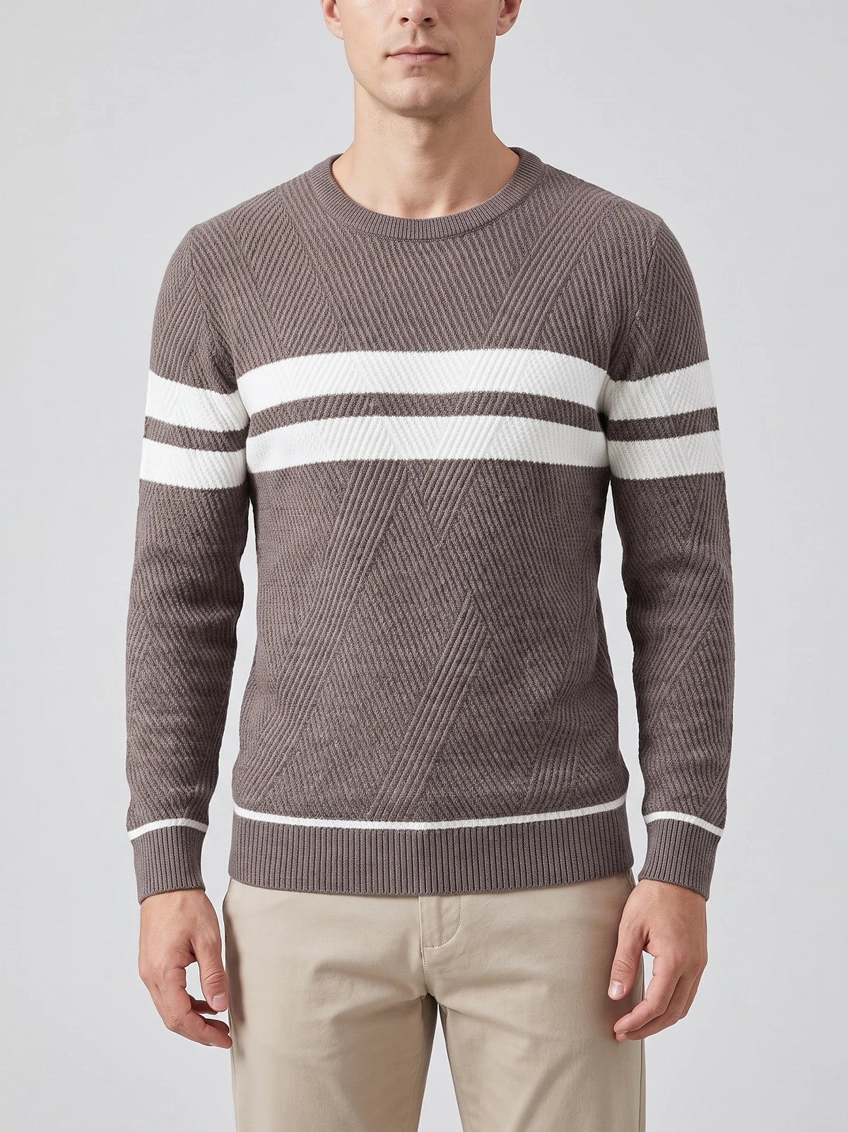 Front studio view of a model wearing a Brown slim cotton crew neck sweater with textured knit and contrasting chest stripes.