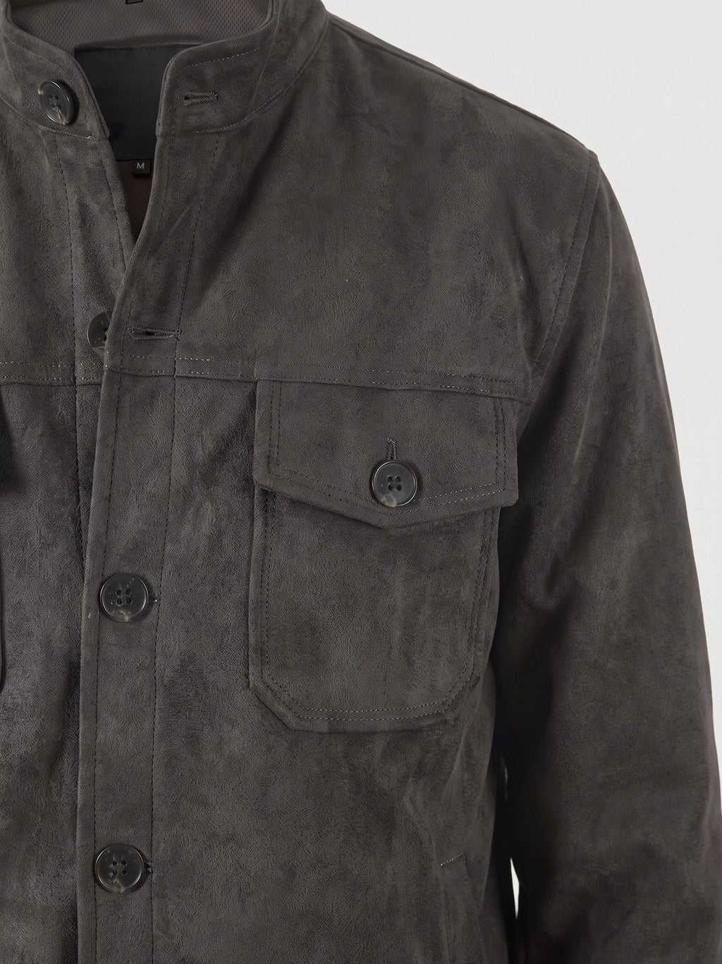 Gray faux suede fall jacket detail showing the stand collar, button front, and buttoned chest flap pocket.