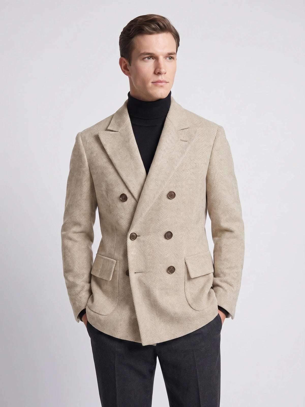 Front studio view of a model wearing a Beige Men Suit Coat with herringbone texture, peaked lapels, and double-breasted button closure.