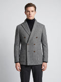Front studio view of a model wearing a Gray Men Suit Coat with herringbone wool texture, peaked lapels, flap pockets, and double-breasted buttons.