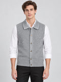 Front studio view of a model wearing a Gray cotton knit Sweater Vest with a lapel collar and single-breasted button closure.