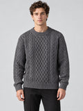 Front studio view of a model wearing a Charcoal Thick Sweater with an O-neck and textured cable-knit pattern.