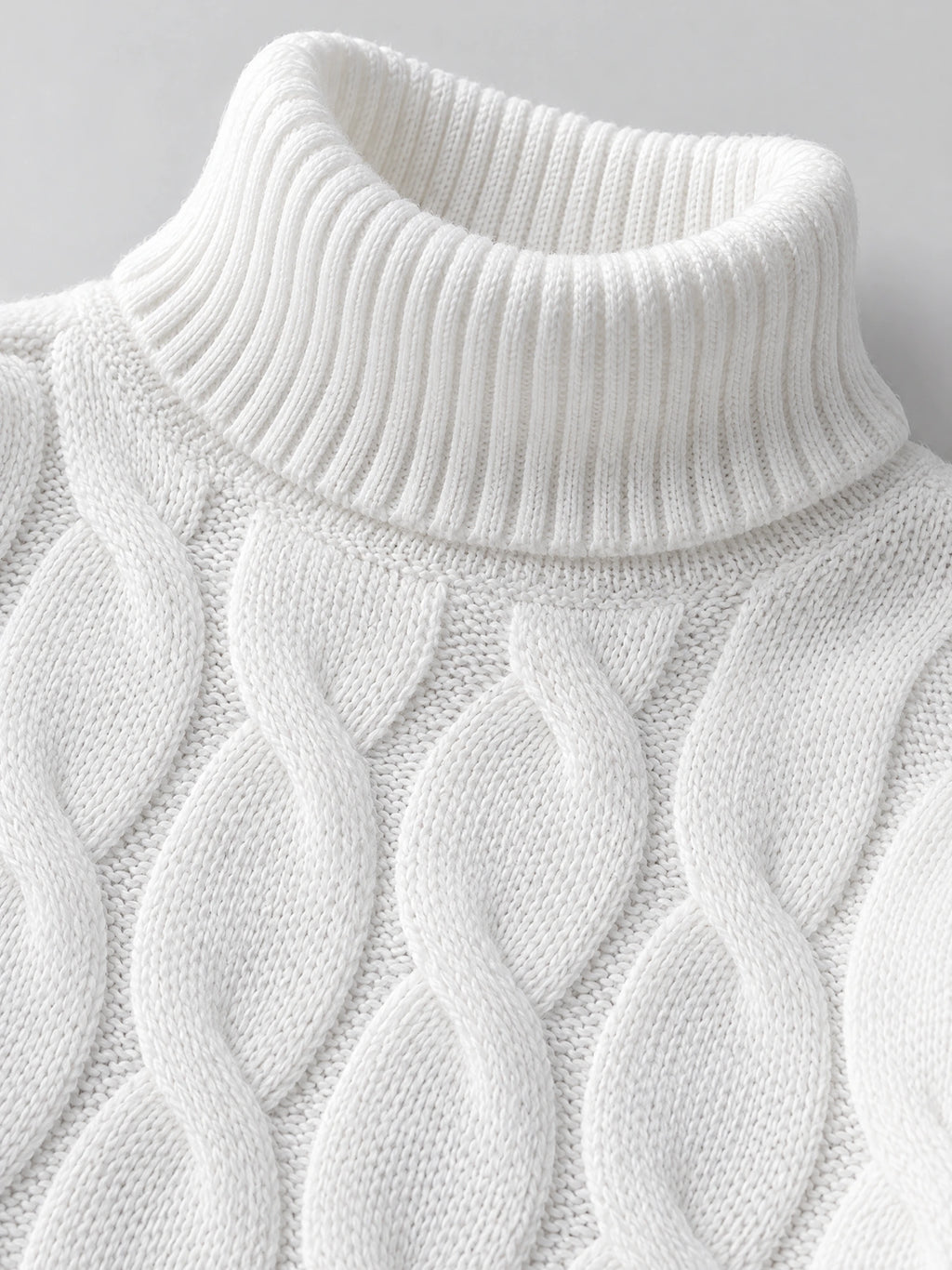 Close-up of the White Turtle Neck Sweater showing its ribbed turtleneck collar and chunky cable-knit texture.