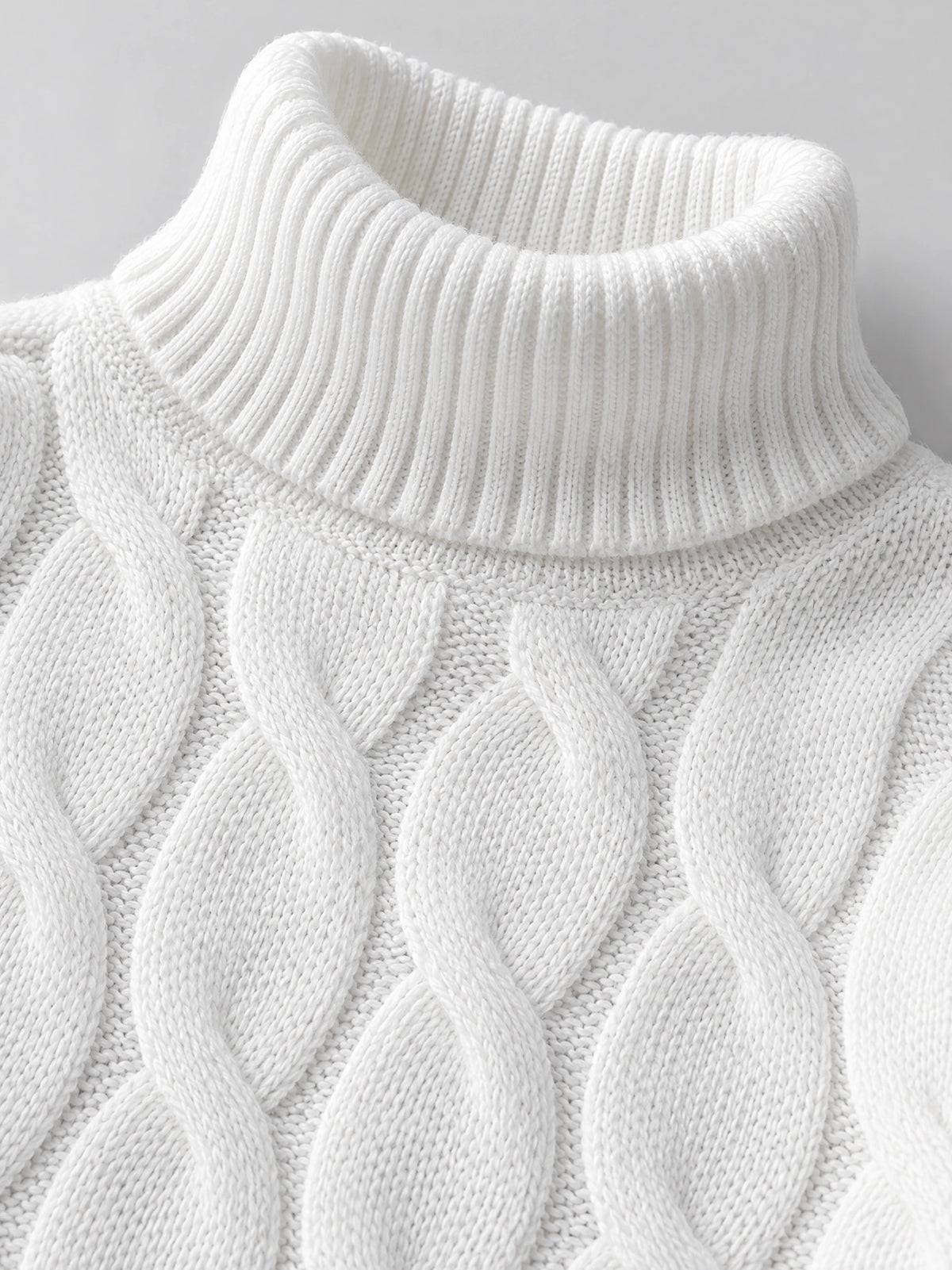 Close-up of the White Turtle Neck Sweater showing its ribbed turtleneck collar and chunky cable-knit texture.