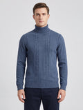 Front studio view of a model wearing a Blue cotton turtleneck sweater with vertical cable-knit detailing.
