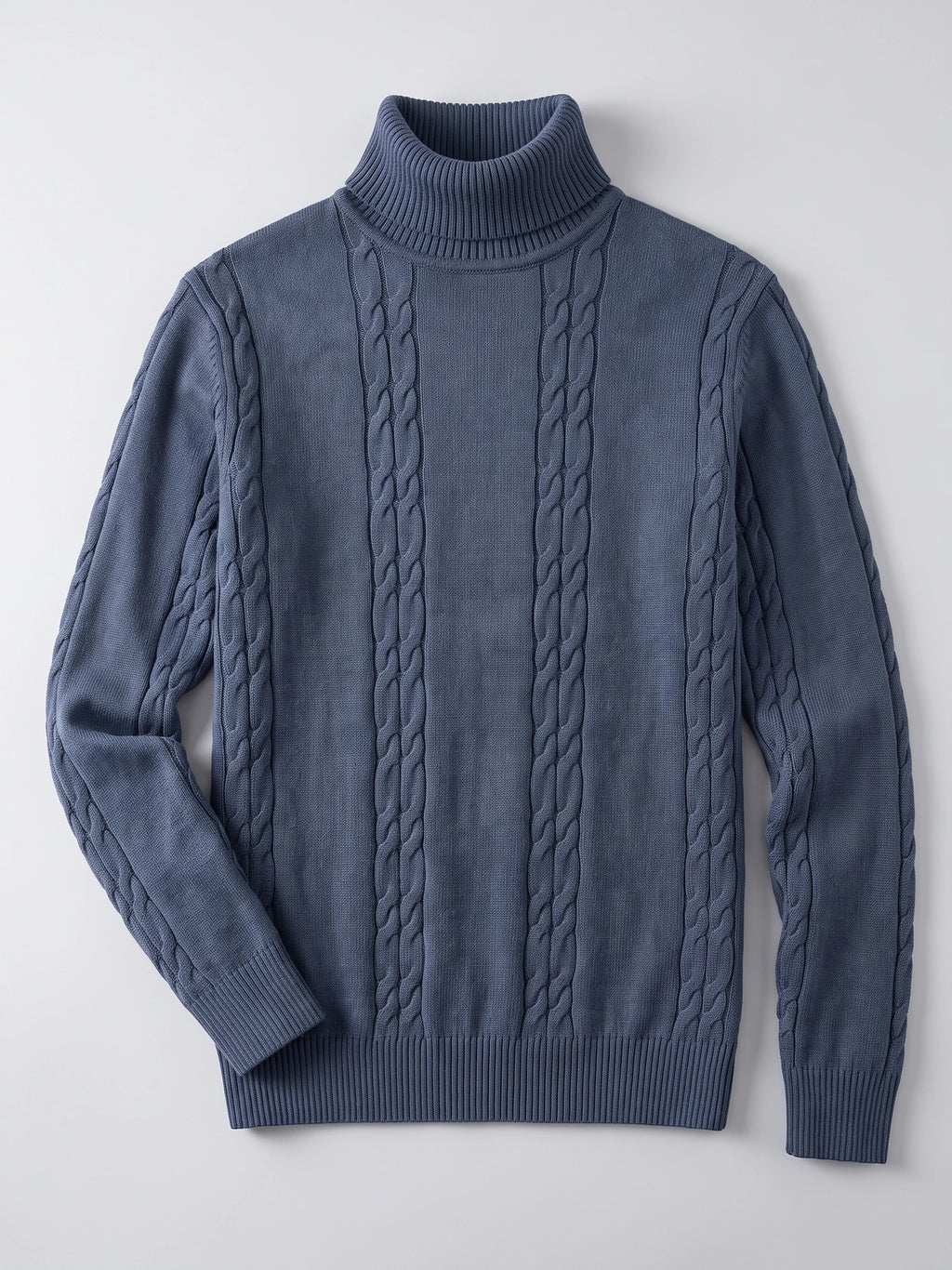 Blue cotton turtleneck sweater laid flat, featuring vertical cable-knit panels and ribbed cuffs and hem.