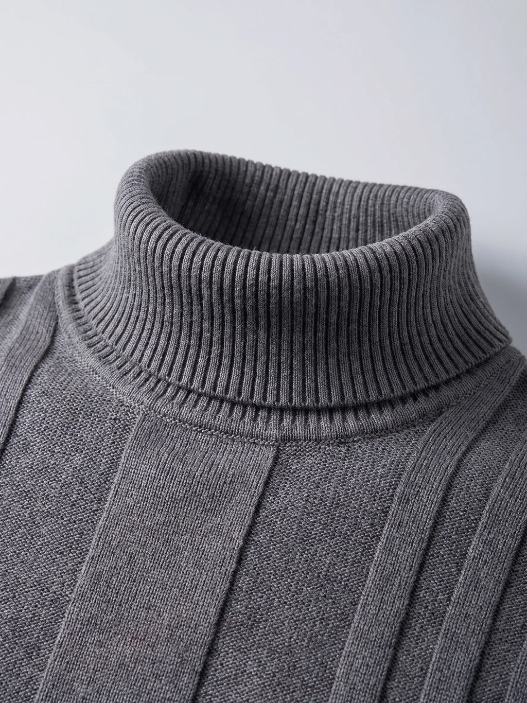 Close-up of the ribbed roll neck and textured knit on a Gray cotton Turtleneck Sweater.