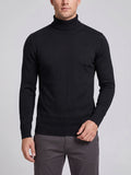 Front studio view of a model wearing a Black slim-fit Turtleneck Sweater with long sleeves and ribbed collar, cuffs, and hem.