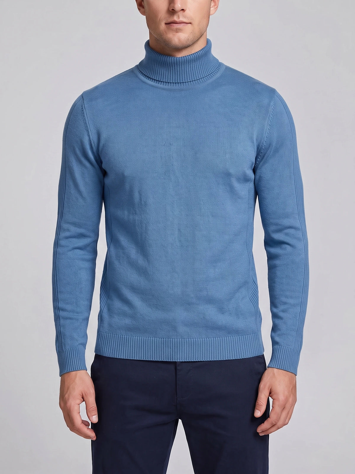 Front studio view of a model wearing a Blue slim-fit Turtleneck Sweater with ribbed high neck, cuffs, and hem.
