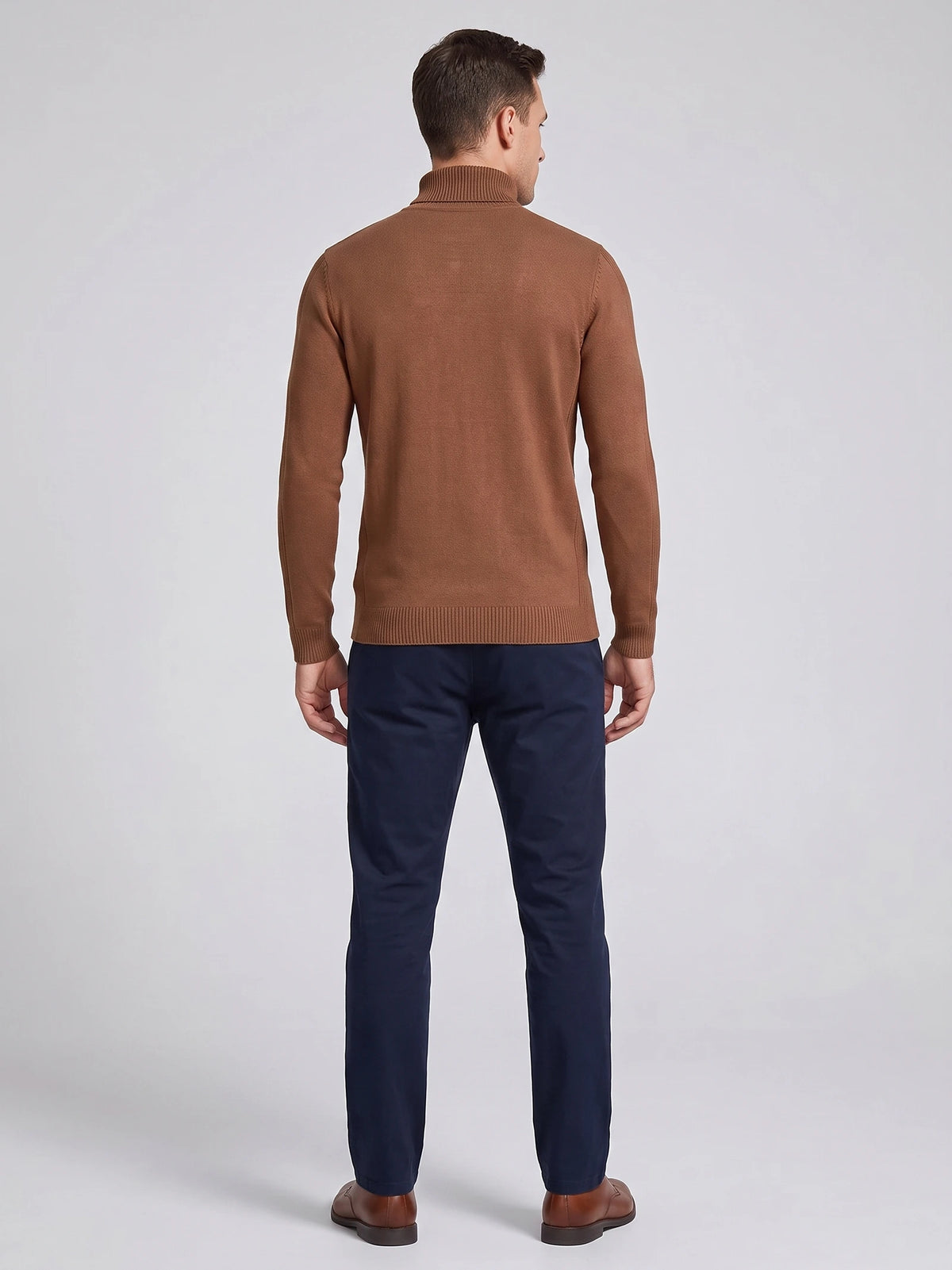 Rear studio view of a model wearing a Brown men's Turtleneck Sweater with long sleeves, ribbed cuffs, hem, and high neck.