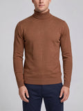 Front studio view of a model wearing a Brown men's turtleneck sweater with ribbed high neck, cuffs, and hem.