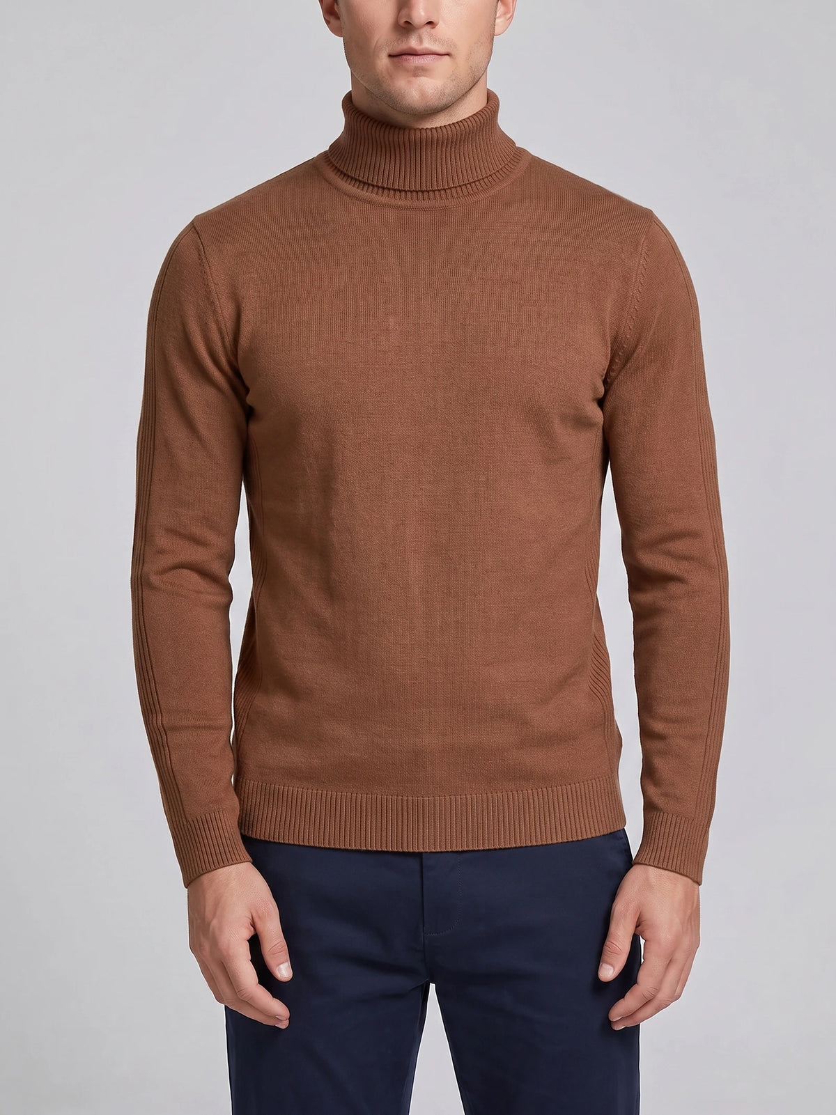 Front studio view of a model wearing a Brown men's turtleneck sweater with ribbed high neck, cuffs, and hem.
