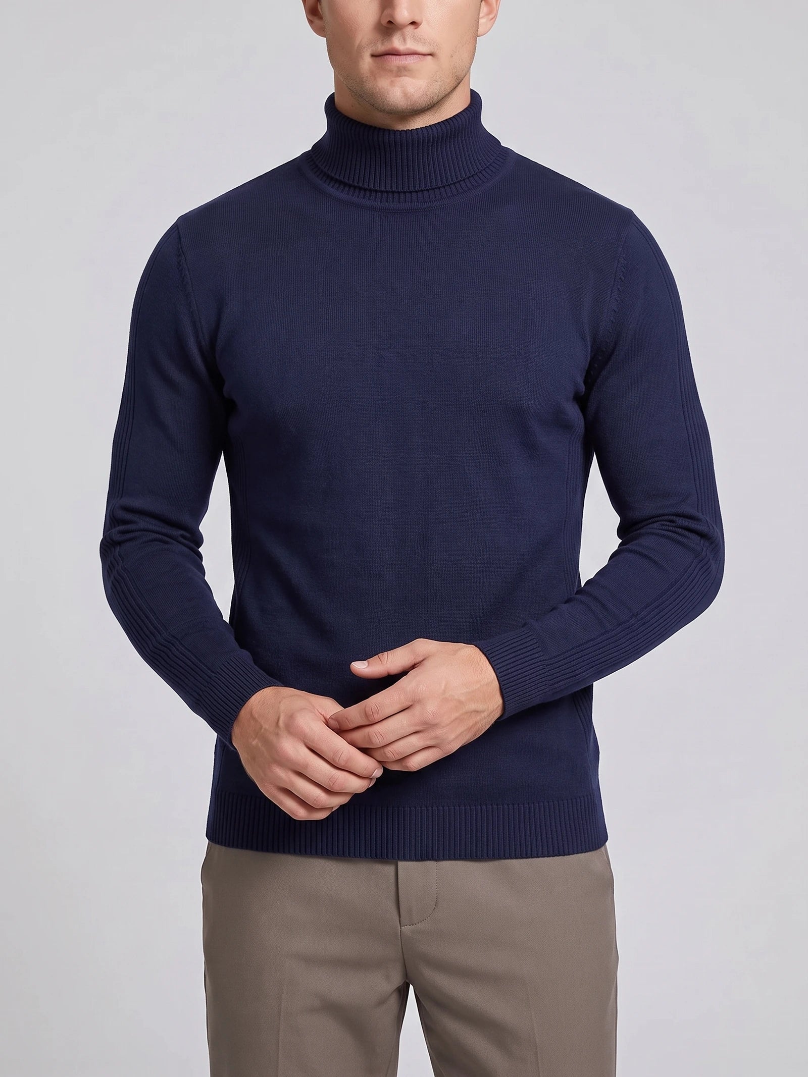 Front studio view of a model wearing a Navy Turtleneck Sweater with a ribbed high neck, cuffs, and hem.