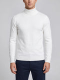 Front studio view of a model wearing a White slim-fit Turtleneck Sweater with ribbed high neck, cuffs, hem, and sleeve detailing.