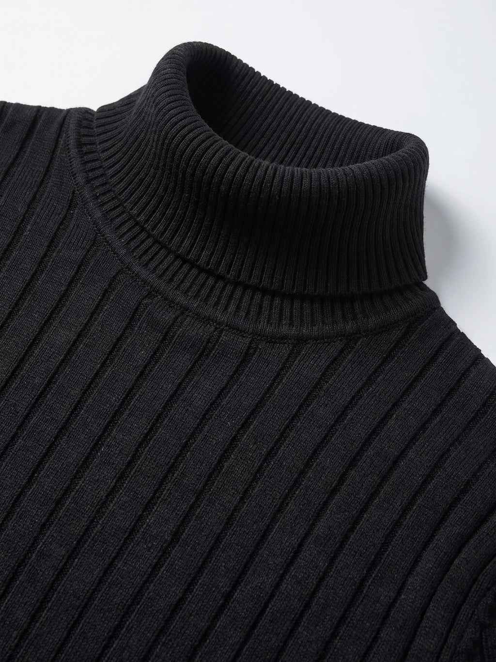 Close-up of the Black men’s Turtleneck Sweater, showing its ribbed fold-over collar and vertical knit texture.