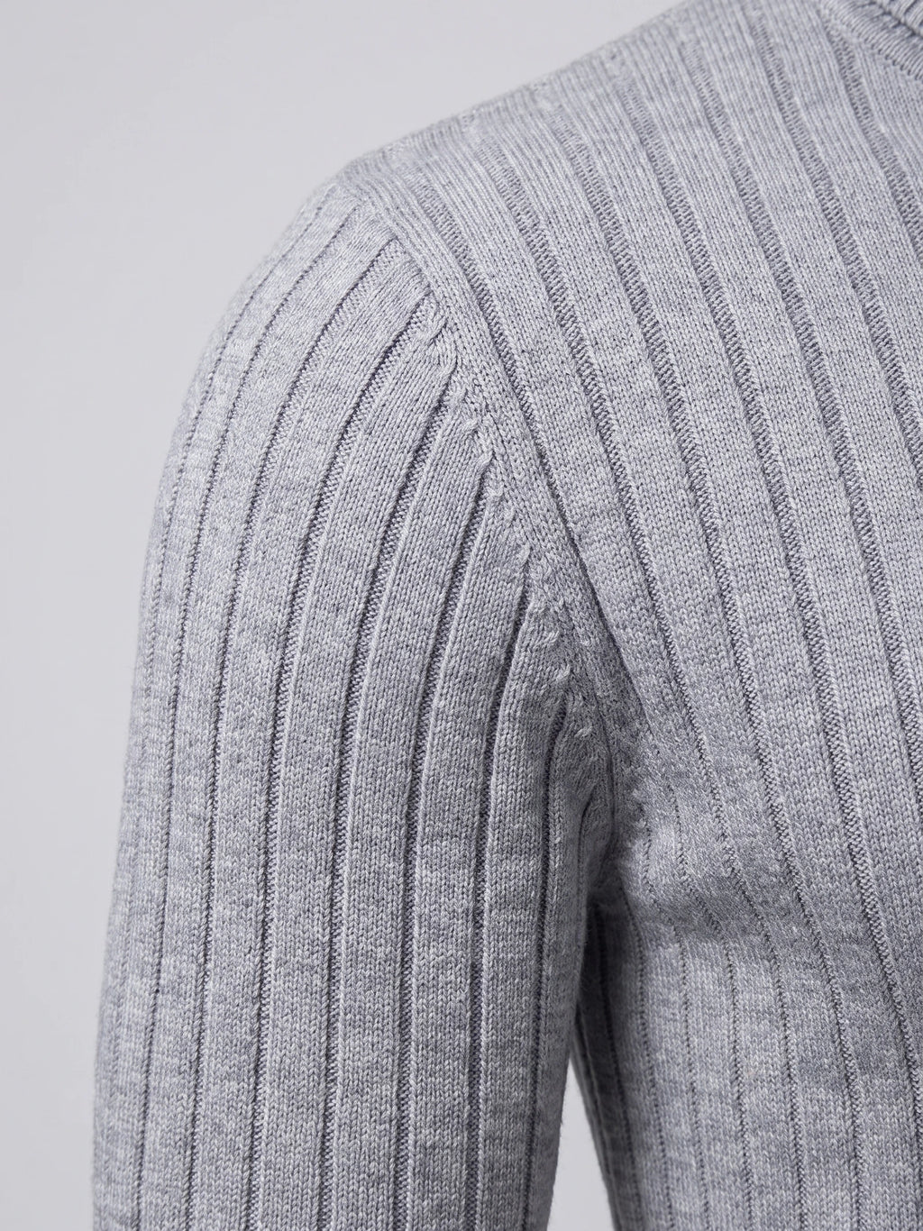 Close-up of the Gray men's turtleneck sweater showing its vertical ribbed knit texture at the shoulder and sleeve.