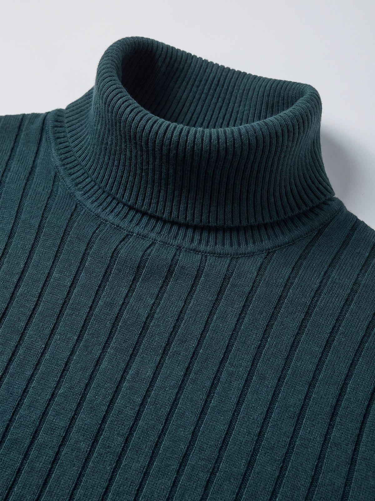 Close-up of the Green men's Turtleneck Sweater, showing its ribbed fold-over collar and vertically textured knit.
