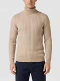 Front studio view of a model wearing a Khaki men's Turtleneck Sweater with vertical ribbed knit detailing.