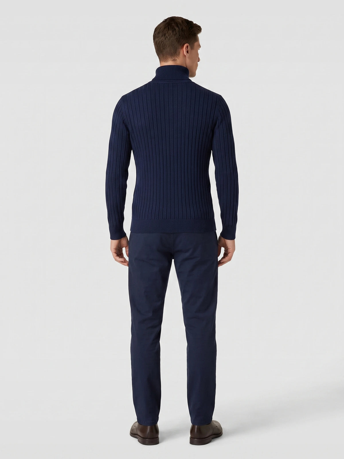 Rear studio view of a model wearing a Navy ribbed Turtleneck Sweater with long sleeves and a fitted hem.