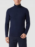 Front studio view of a model wearing a Navy ribbed knit Turtleneck Sweater.