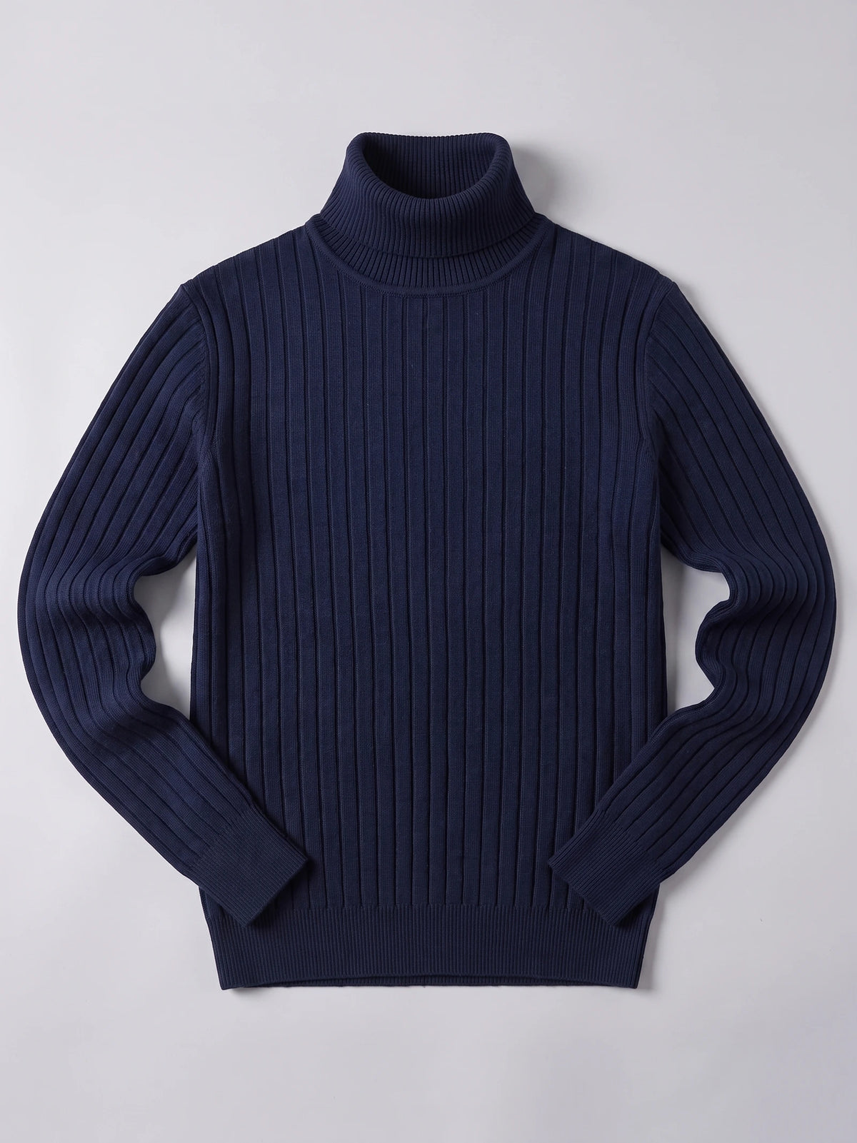 Navy men's turtleneck sweater laid flat, featuring a ribbed knit body, long sleeves, and ribbed cuffs and hem.