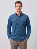 Front studio view of a model wearing a Blue Twill Tweed Shirt with a button-down collar and two button-flap chest pockets.