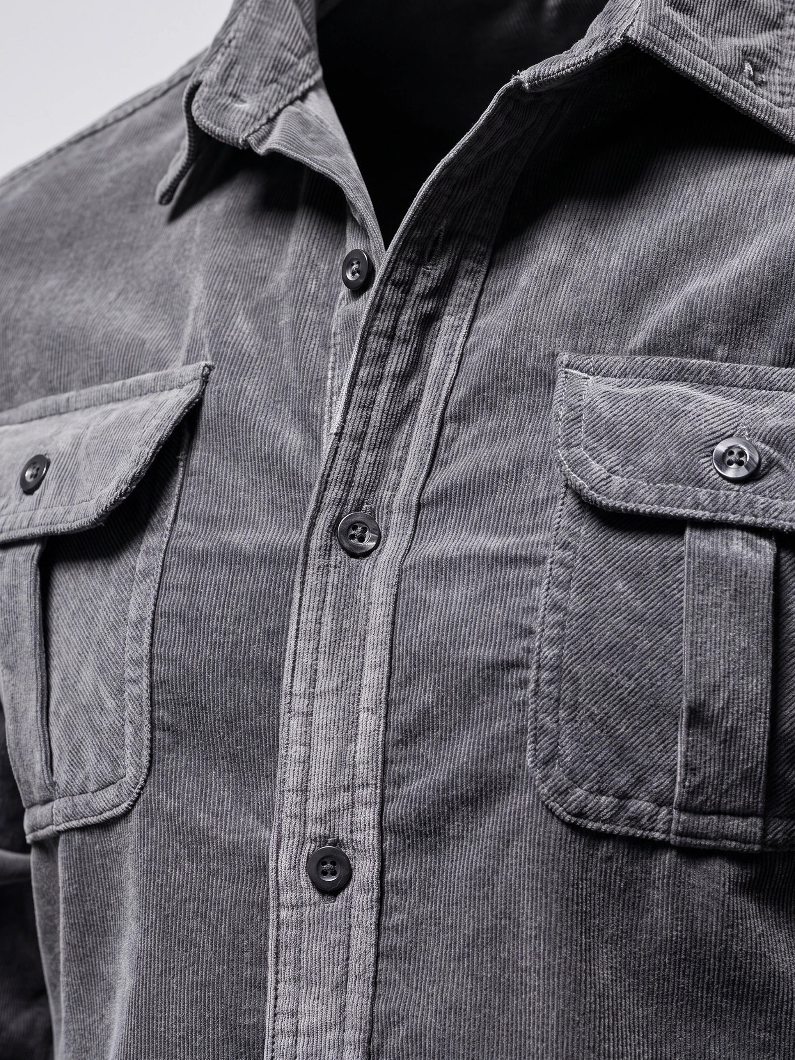 Close-up of the Gray Twill Tweed Shirt showing its fine ribbed texture, pointed collar, button placket, and flap chest pockets.