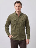 Front studio view of a model wearing a Green Twill Tweed Shirt with a button-down collar and two button-flap chest pockets.
