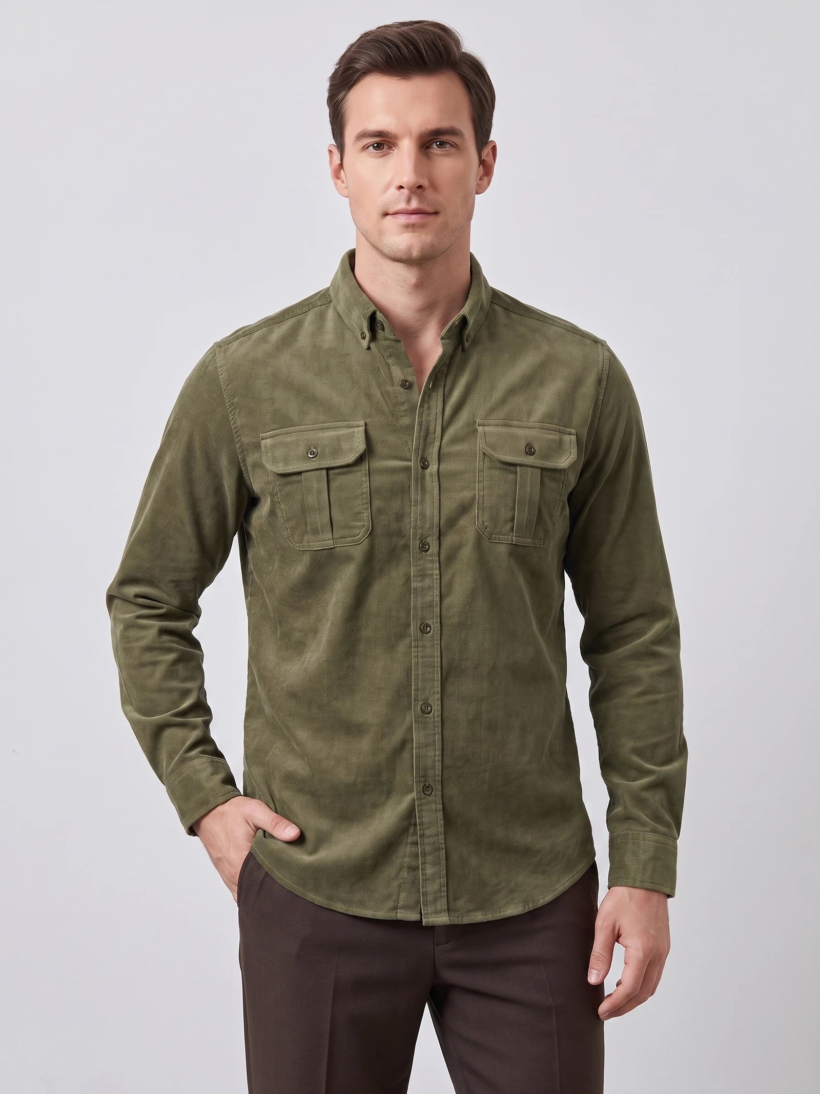 Front studio view of a model wearing a Green Twill Tweed Shirt with a button-down collar and two button-flap chest pockets.