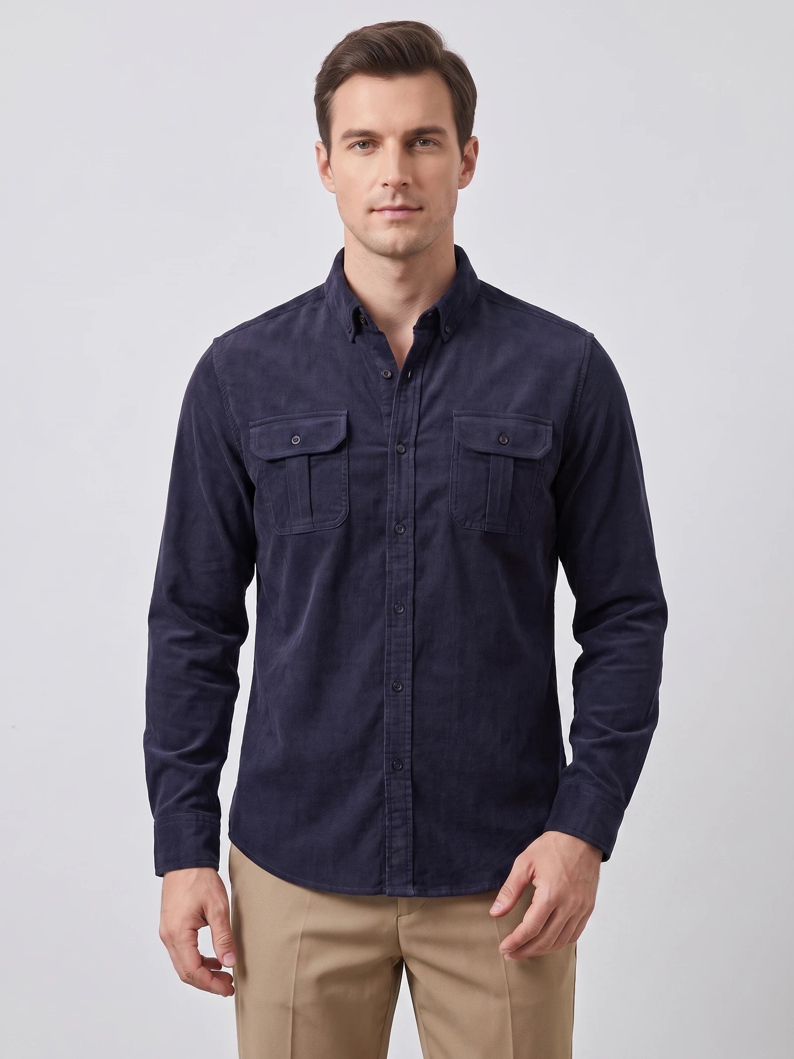 Front studio view of a model wearing a Navy Twill Tweed Shirt with a button-down collar and two button-flap chest pockets.