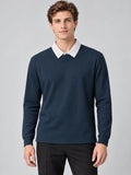 Front studio view of a model wearing a Navy two piece polo shirt with a layered collared neckline and long sleeves.