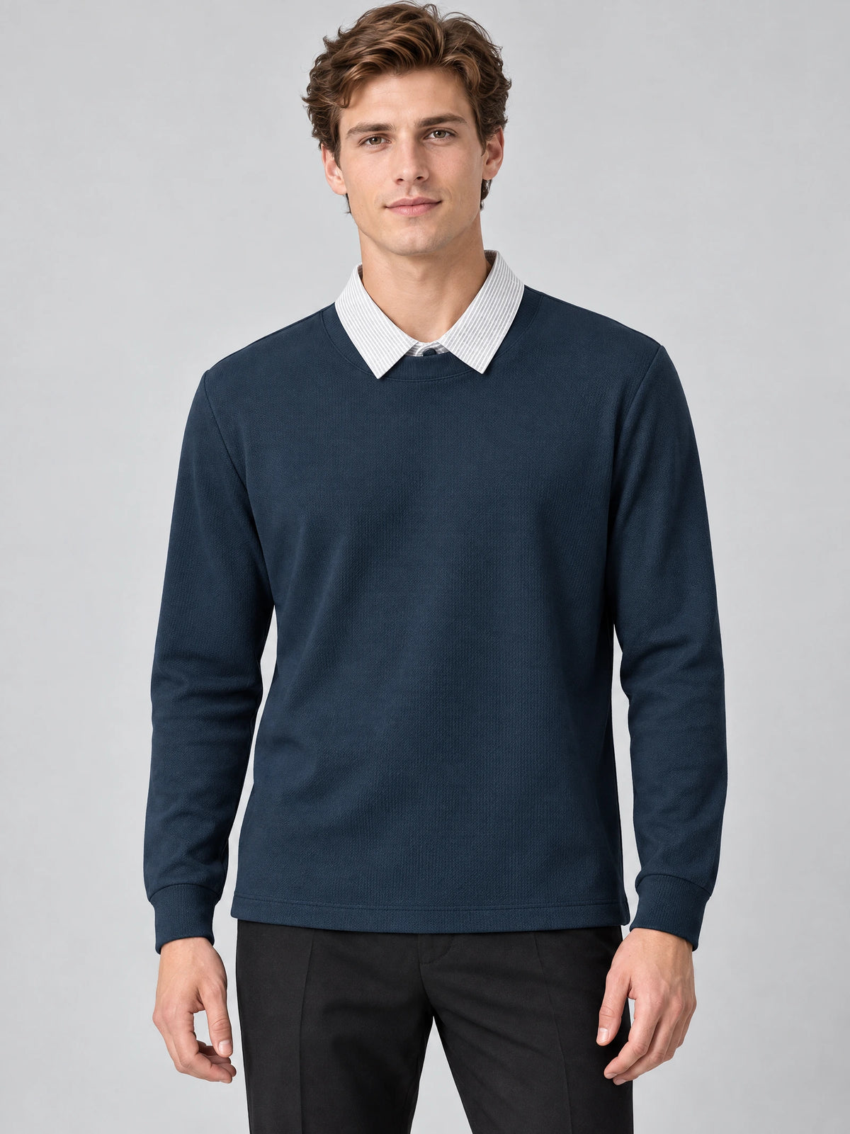 Front studio view of a model wearing a Navy two piece polo shirt with a layered collared neckline and long sleeves.