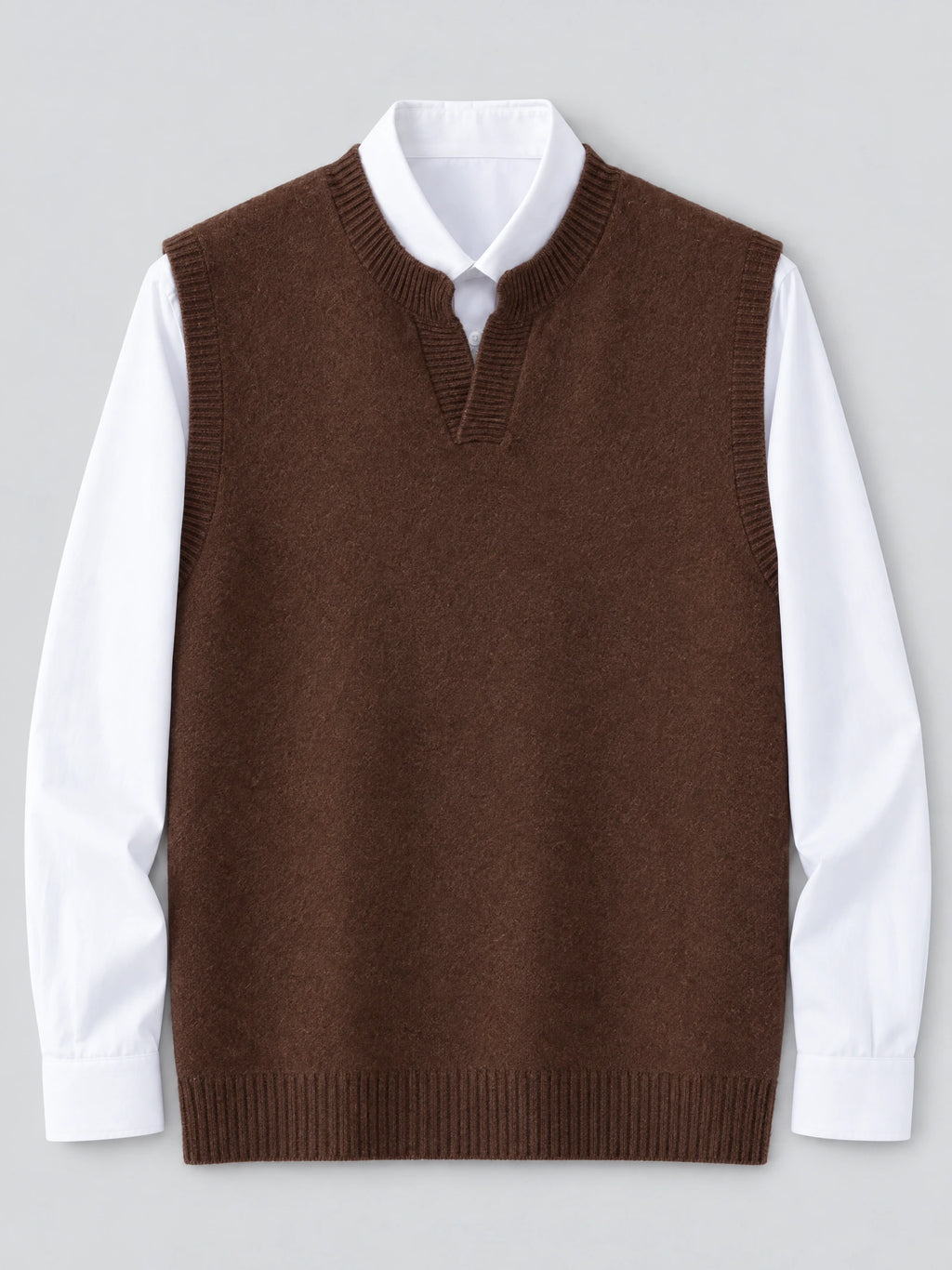 Brown wool v neck sweater vest laid flat over a collared shirt, showing ribbed trim and hem.