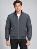 Model wearing a Gray Winter Bomber Jacket with diamond quilting, stand collar, front zipper, and zippered pockets in a studio front view.