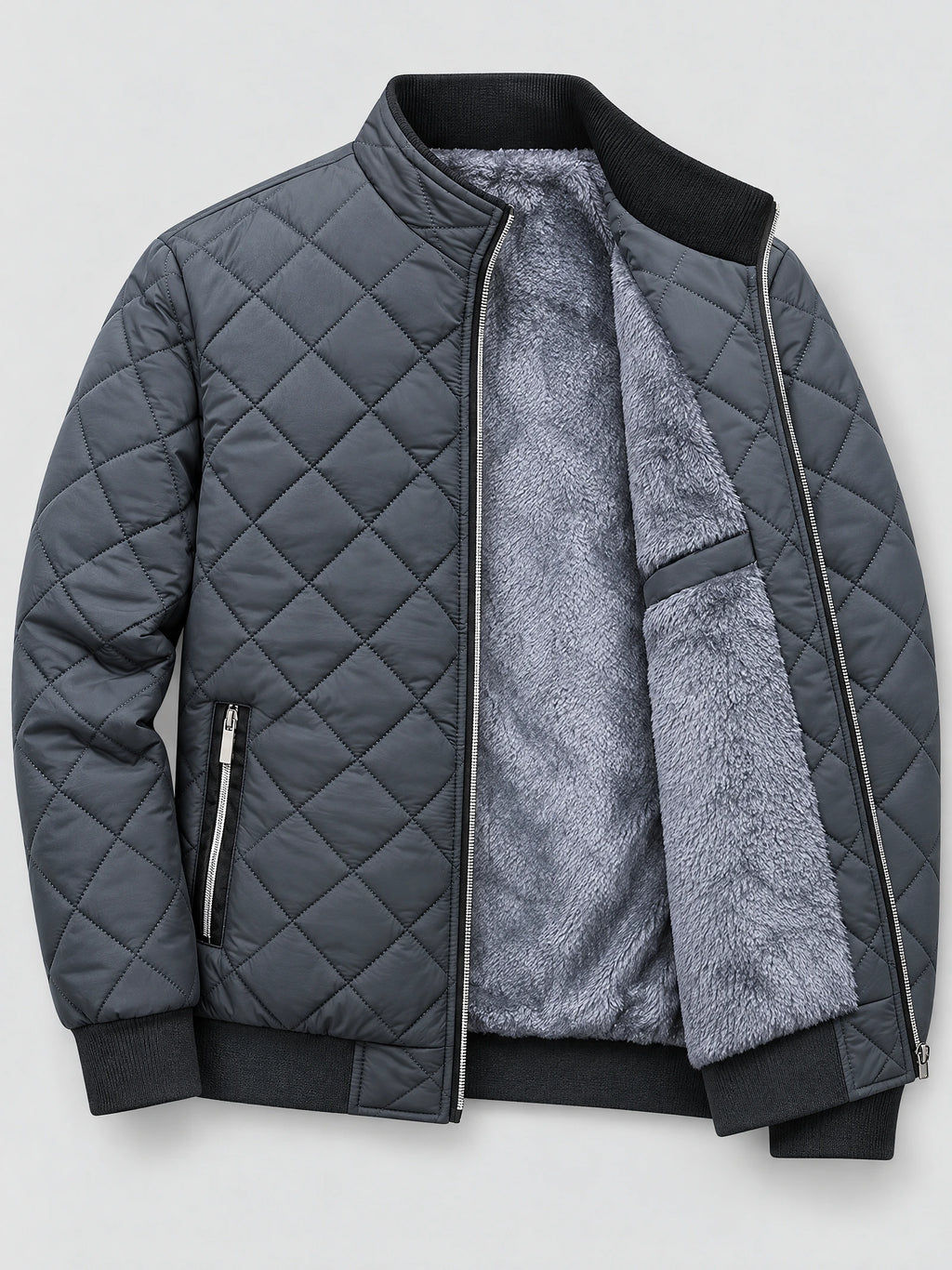 Gray winter bomber jacket laid flat with diamond quilting, ribbed trim, zip pockets, and exposed fleece lining.