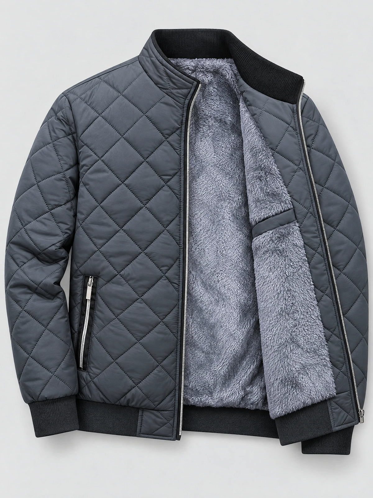Gray winter bomber jacket laid flat with diamond quilting, ribbed trim, zip pockets, and exposed fleece lining.