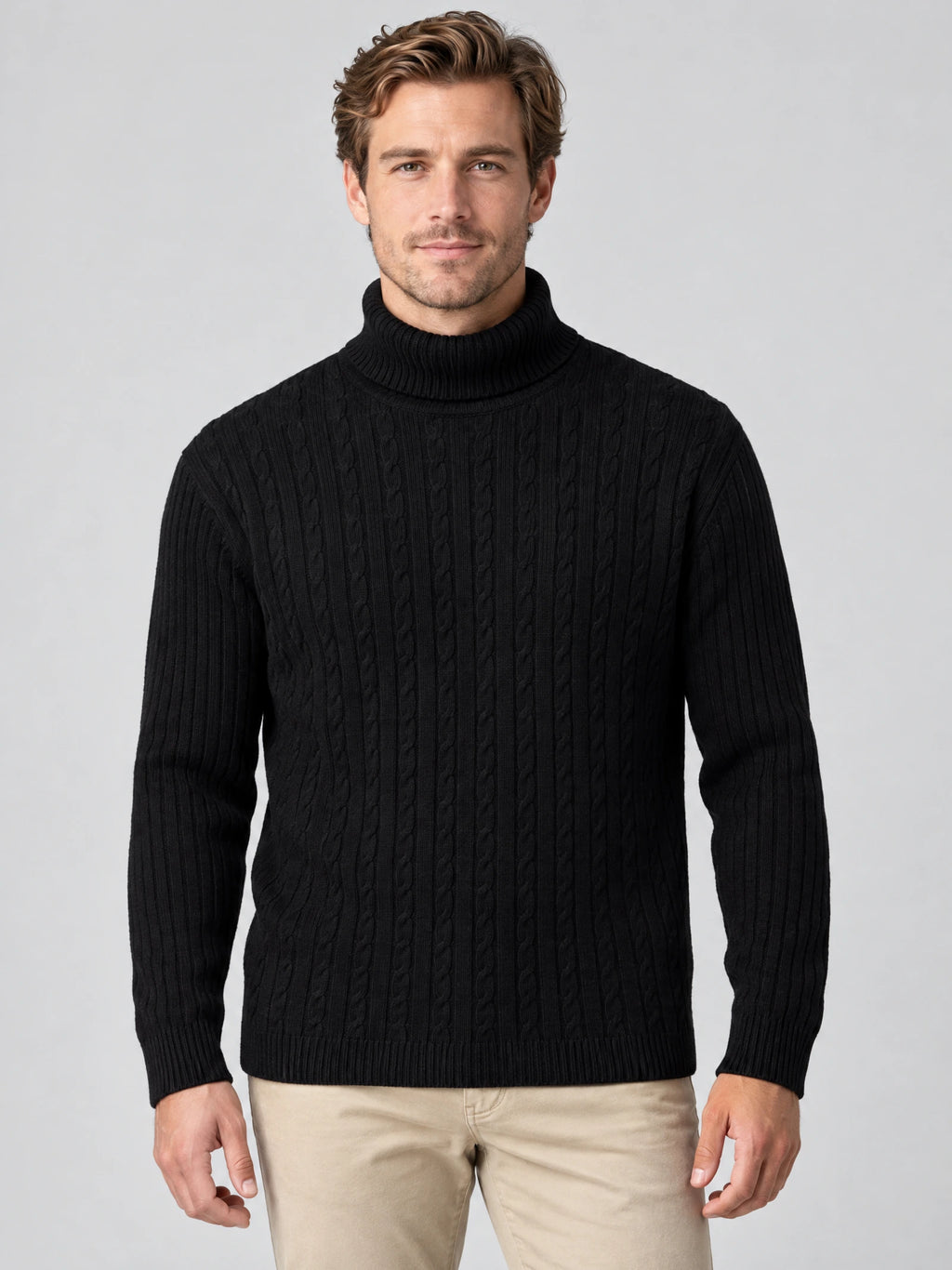 Model wearing a Black cable-knit Winter Sweater with a ribbed turtleneck in a front studio view.