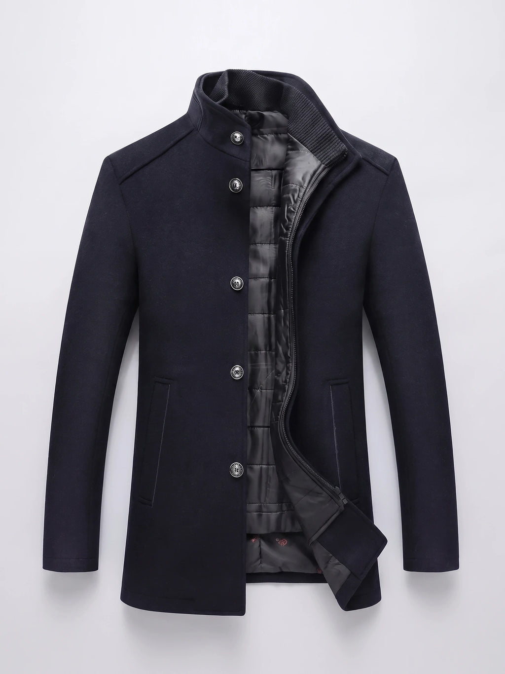 Navy wool overcoat laid flat with a stand collar, button-front closure, zippered quilted inner layer, and welt pockets.
