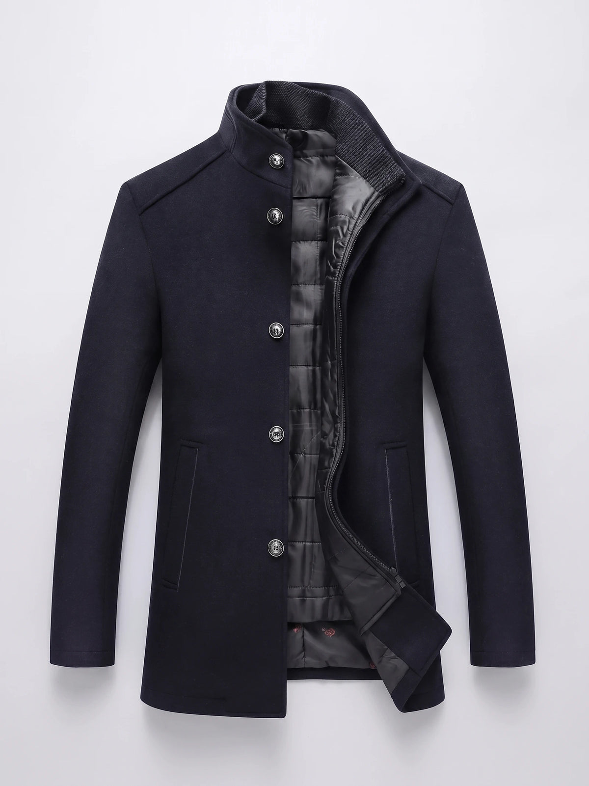 Navy wool overcoat laid flat with a stand collar, button-front closure, zippered quilted inner layer, and welt pockets.